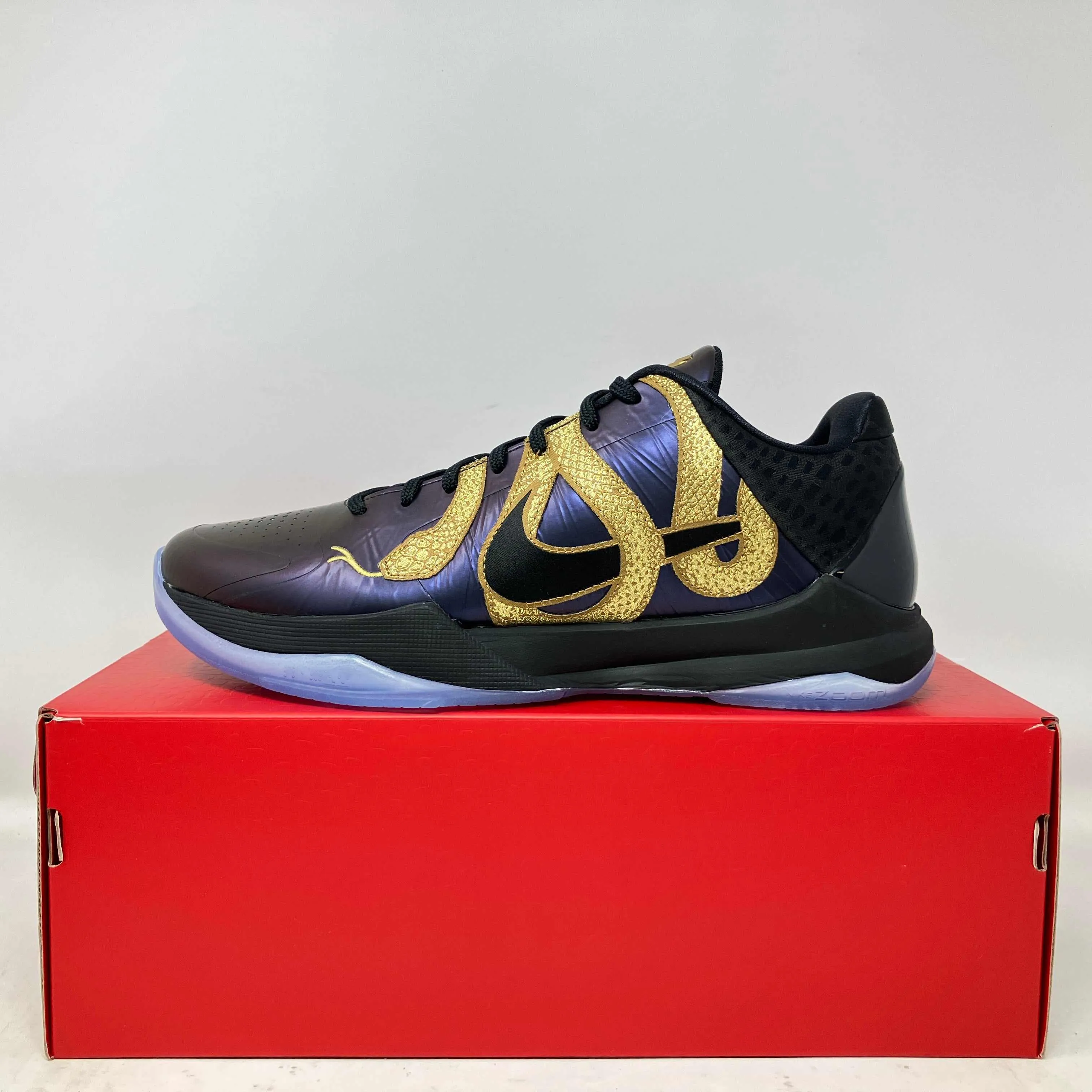 Nike Kobe 5 Protro Year of the Mamba Eggplant black and gold basketball shoe on red box, brand new with accessories included